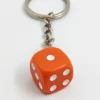 dice-keychain-a-close-up-of-a-keychain-with-a-dice-on-it