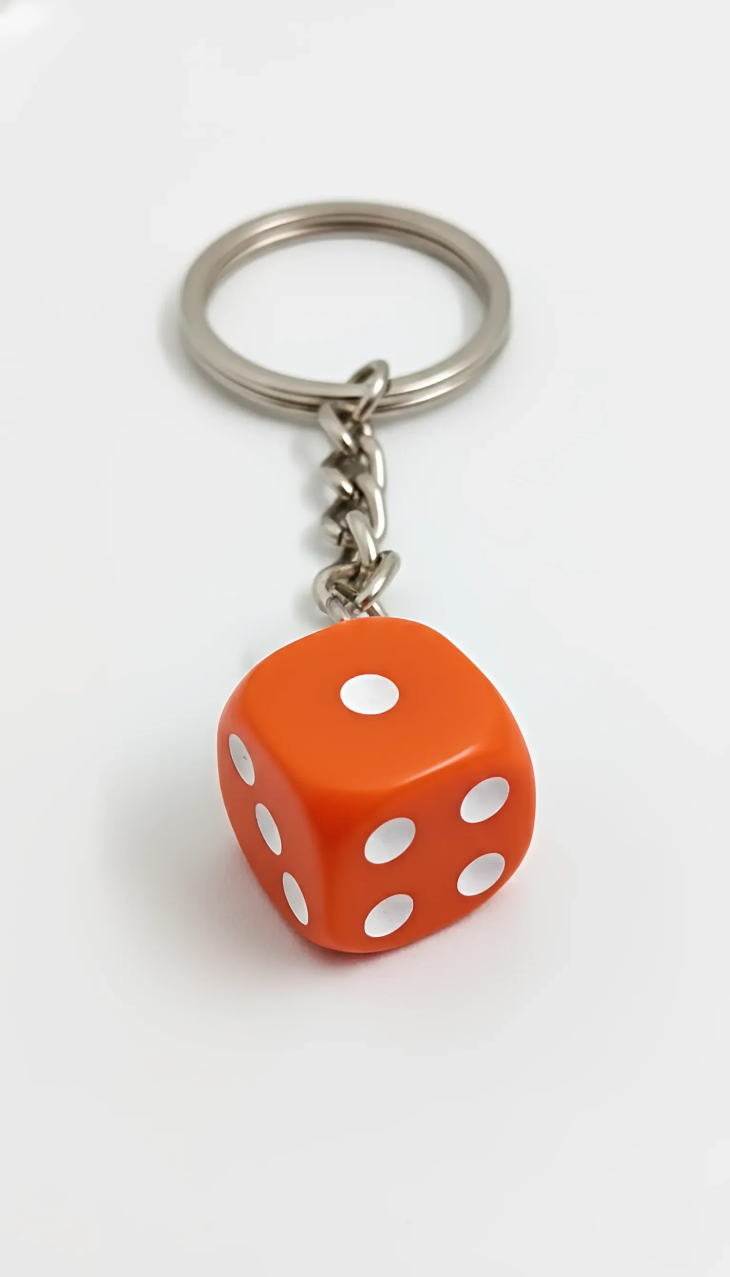 dice-keychain-a-close-up-of-a-keychain-with-a-dice-on-it