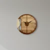 woodpecker-wall-clock-there-is-a-clock-on-the-wall-above-a-wooden-entertainment-center